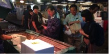 JAFPE volunteers tour and shop at the Tukiji Wholesale Market for the last time.